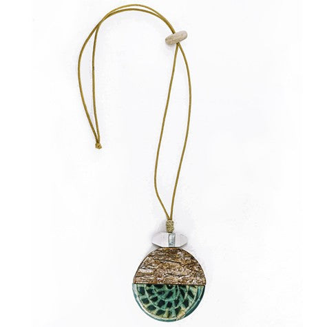 JUNGLE DISC PENDANT NECKLACE